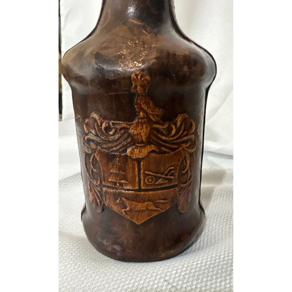 Vintage Leather Wrapped Decanter Bottle Embossed Coat of Arms Crest Wood Stopper